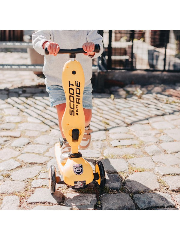 Scoot and Ride - Highwaykick 1 - Lemon scooter being used on cobblestone path, ideal for outdoor fun.